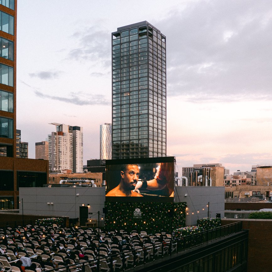 rooftop cinema club at the emily hotel fulton market chicago screening the movie with bunch of guests enjoying the screening