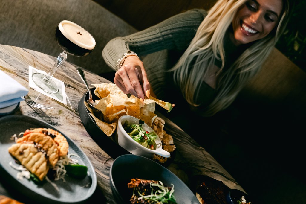 a girl having brunch at fora chicago the emily hotel