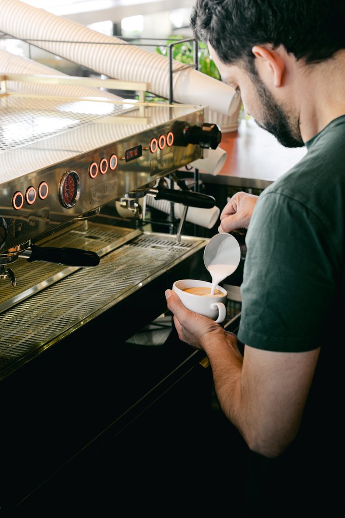 barista making coffee at the coffee bar the emily hotel chicago