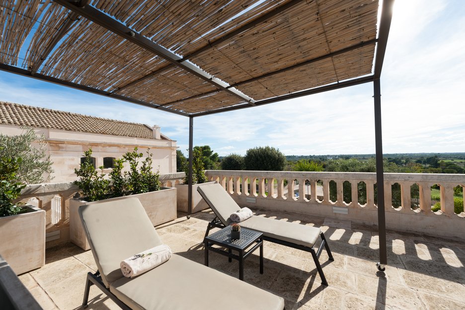 private terrace of deluxe superior room at villa torre bianca by emily hotels