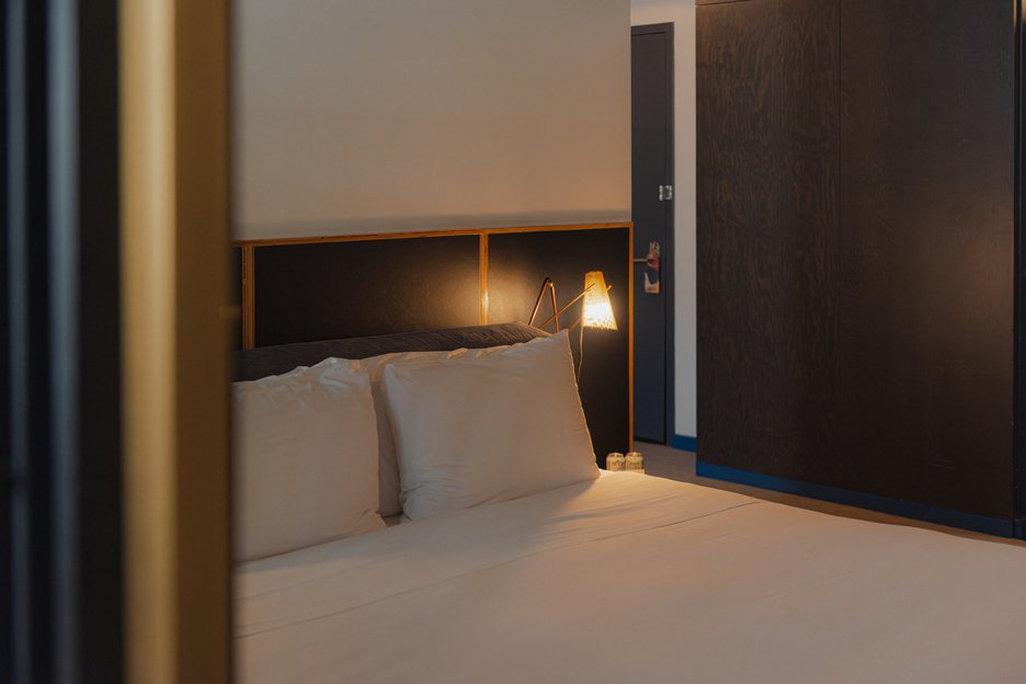 Emily Hotel's hotel room corner of king sized bed