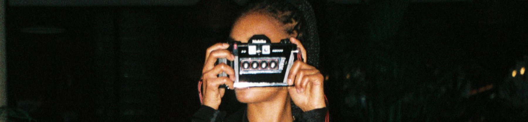 HOTEL - girl holding camera