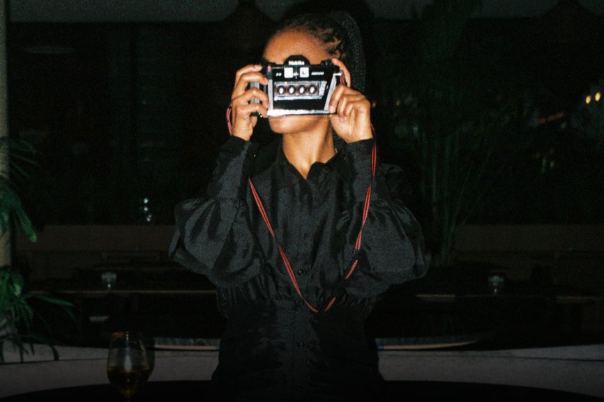 HOTEL - girl holding camera