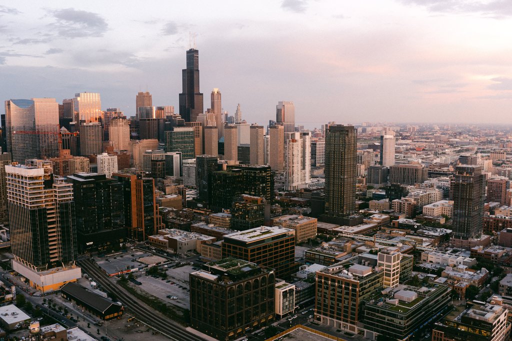 aerial view of Chicago during sunset with high rise buildings, Willis Tower from Fulton Market neighborhood