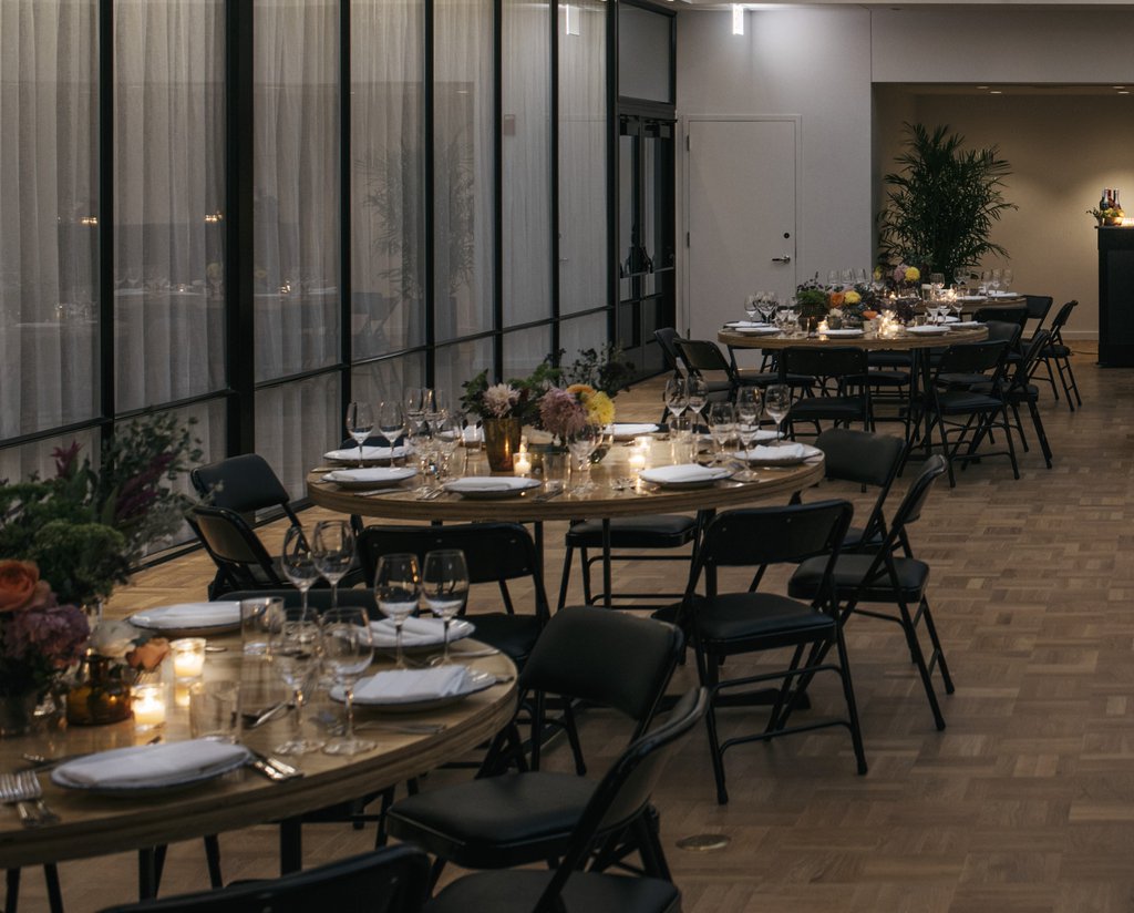 burroughs meeting space at the emily hotel set up for a banquet with round tables and glasses_cropped