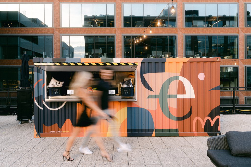 couple walking pass the emily bar at rooftop cinema club