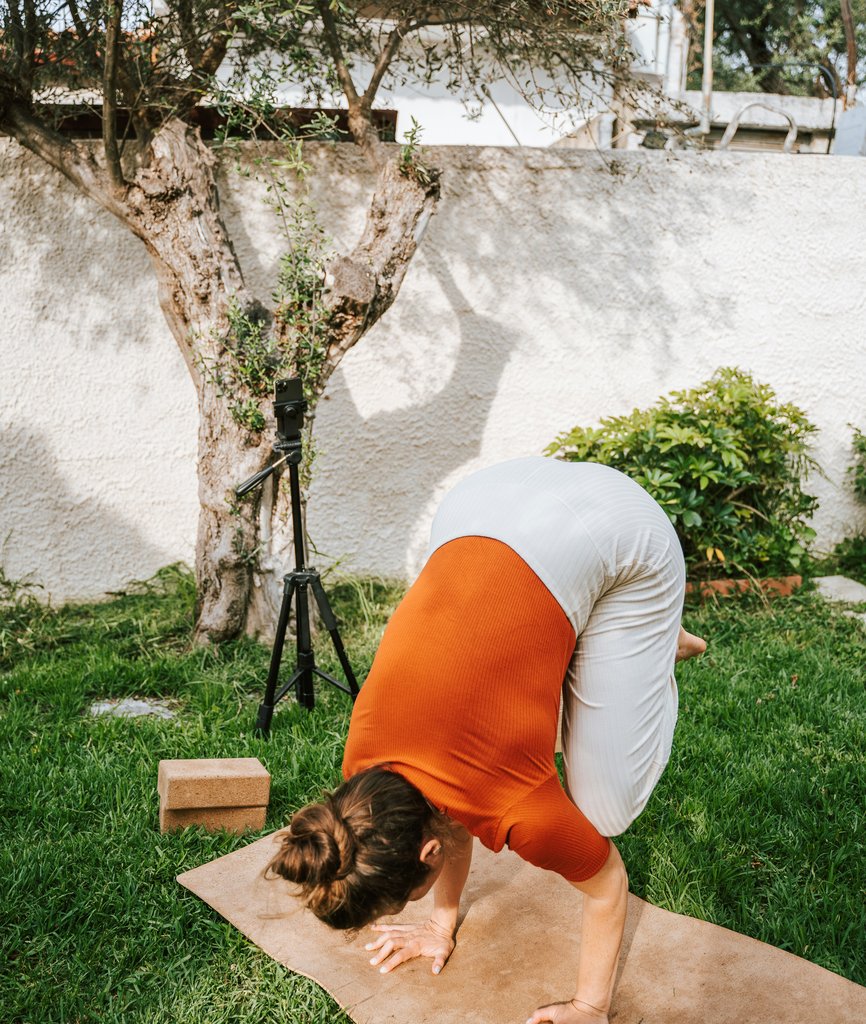 woman doing yoga pose outside