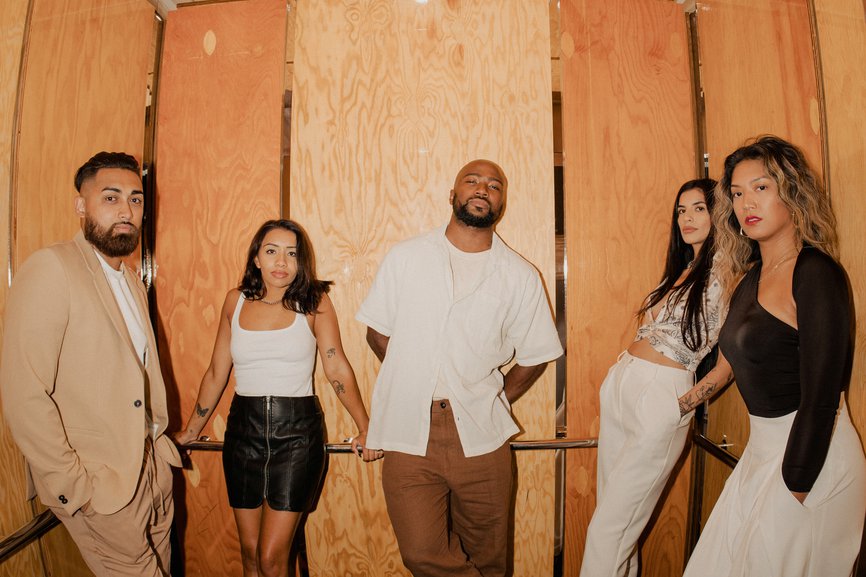 five people in the elevator dressed up going for a night atselva (1)