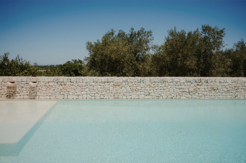 an outdoor pool at villa torre bianca