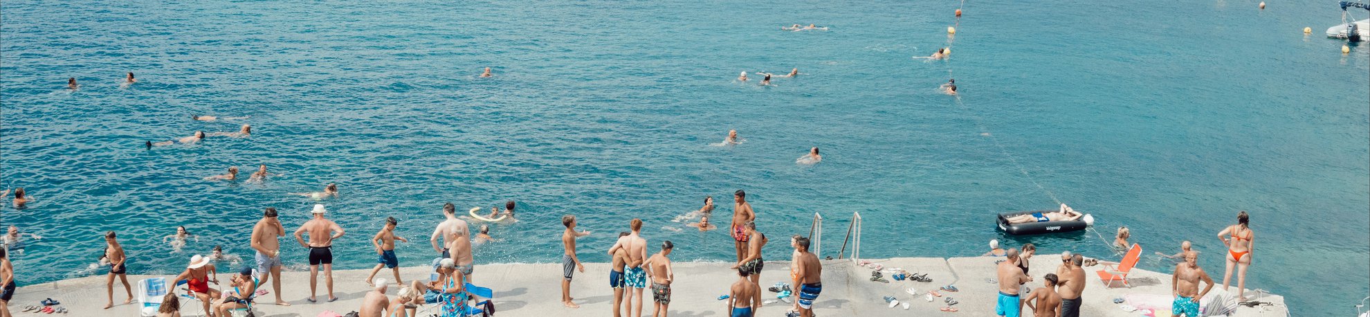 people by water in puglia