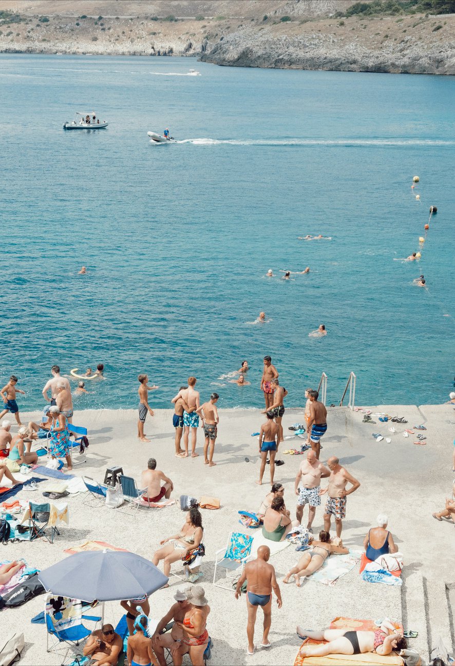 people by water in puglia