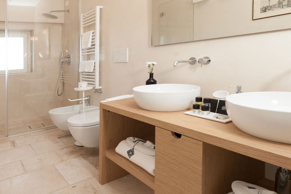 Deluxe Superior bathroom with two sinks at Villa Torre Bianca by Emily Hotels in in the heart of the Apulian