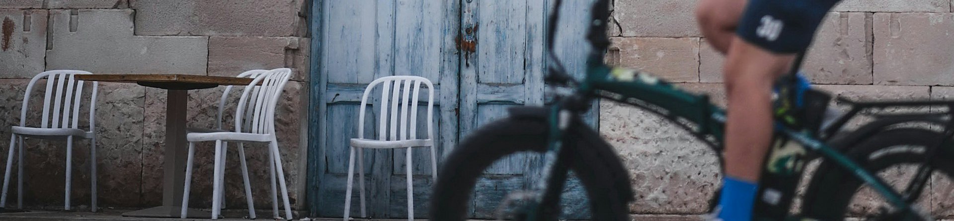 Young man bikes in steets of Puglia