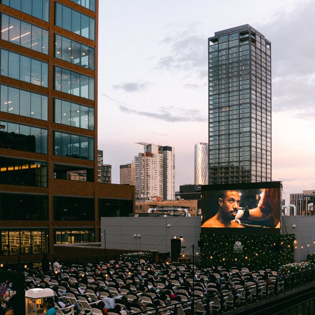 rooftop cinema club at the emily hotel fulton market chicago screening the movie with bunch of guests enjoying the screening