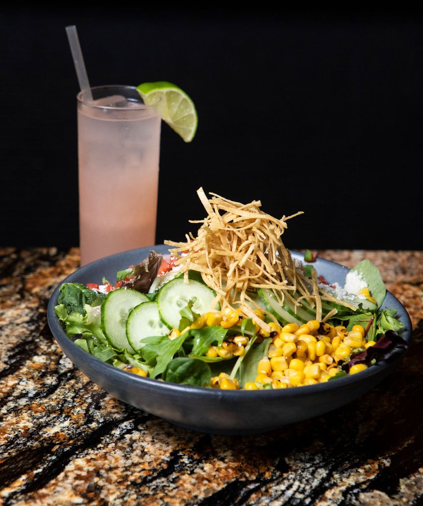 selva corn salad appertizer with signature cocktail at selva chicago the emily hotel