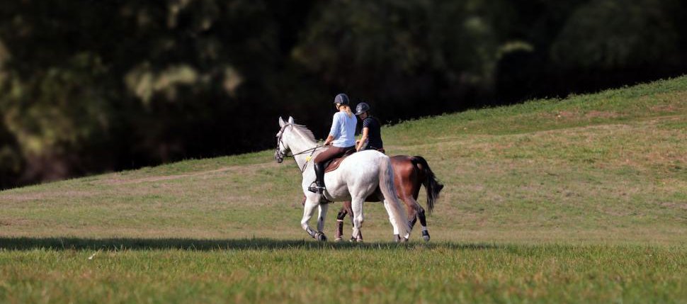 two-people-riding-horses