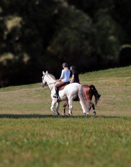 two-people-riding-horses
